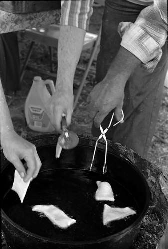 Scones (fry bread) cooking in oil in demonstration at the second annual Folklife Festival, Zion National Park Nature Center, September 1978.