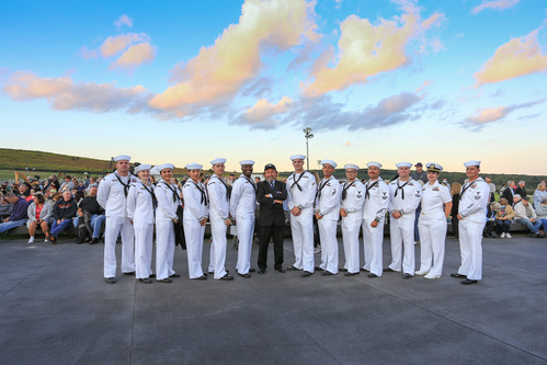 The sailors posing at sunset.