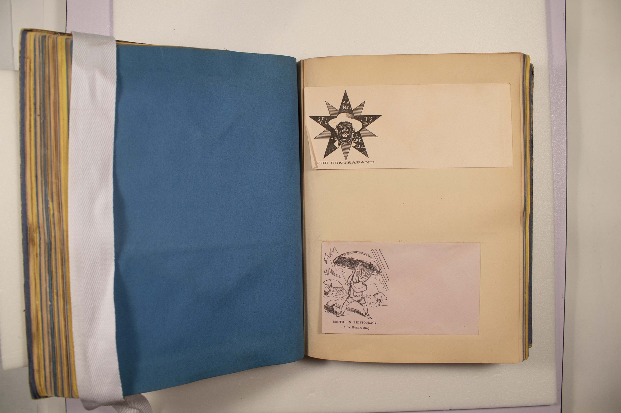 Back of two envelopes which have been glued to page.