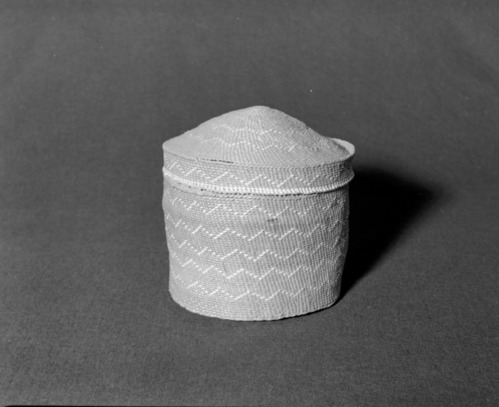 Marie Rozier Collection, Catalog No. 127. Object: Northwest Coast basket. Dimensions: 8 x 8 1/2". Materials: Red cedar root, beargrass. Technology: Plain twined, up to right slant of turns. Collection History: Purchased in Yellowstone in 1928 by Mary Long. Photographed by Michael Dixon in December 1982. Catalogued by Craig Bates and Barbara Beroza. Yosemite Collections, National Park Service.