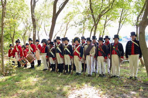 Living historians along the natural shoreline at Todd's Inheritance