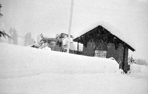 Snowstorm and blocking of highway. Snow and truck at East Entrance station.