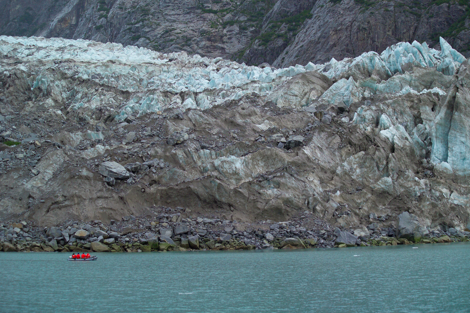 Researchers in inflatable boat in front of glacier 2005