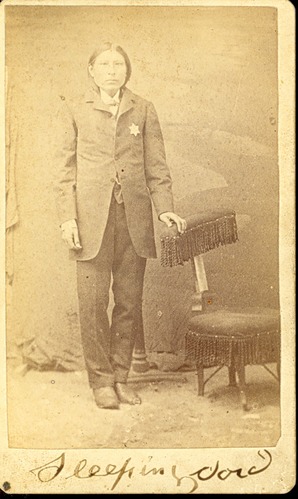 Native American Man in Tailored Suit and Police Badge