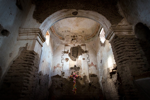 large arched opening with decorative sanctuary beyond