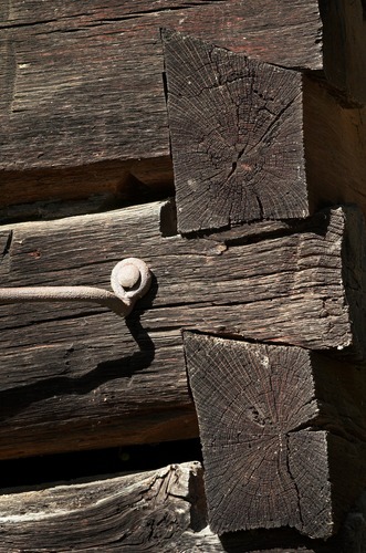 chestnut log barn wall close-up