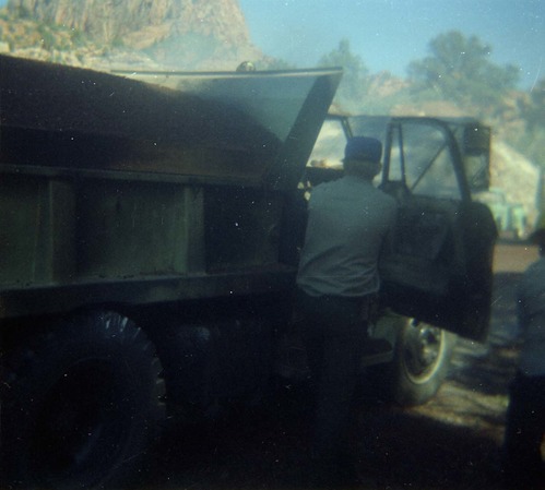 Color photo of an engine fire in a pickup.