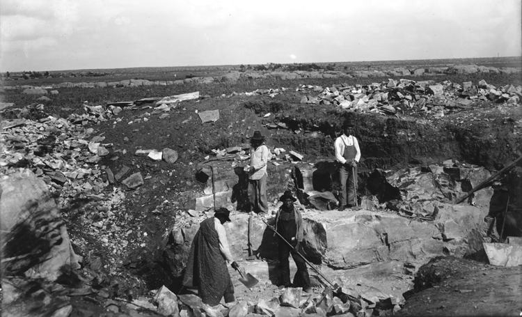 4 men in a quarry working