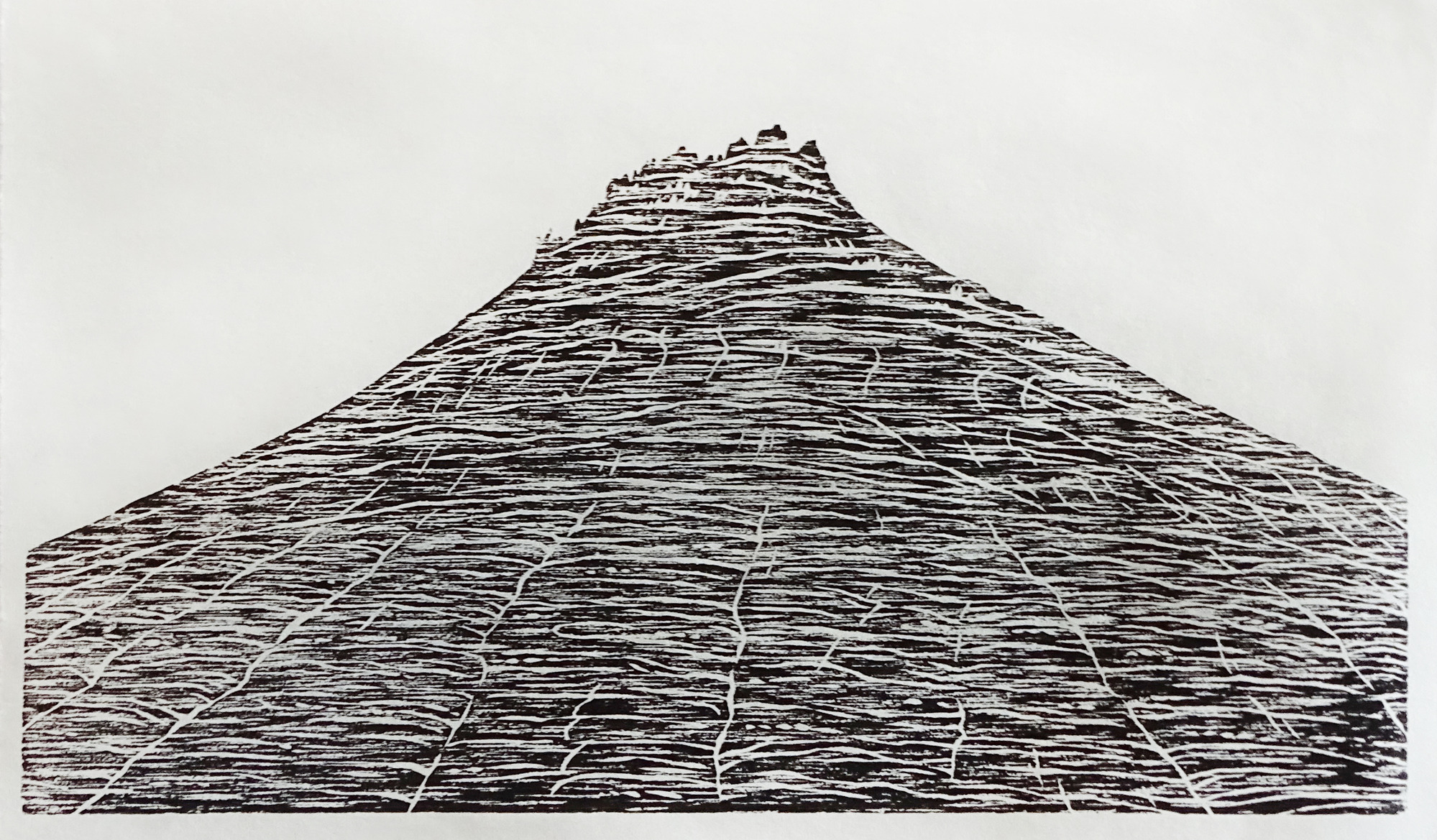 A black-and-white image made with ink printed on paper. This image shows the "Checkerboard Mesa" at Zion National Park, which is a large sandstone peak. The checkerboard texture is created by cracks in the stone, which run horizontally and vertically, forming squares.