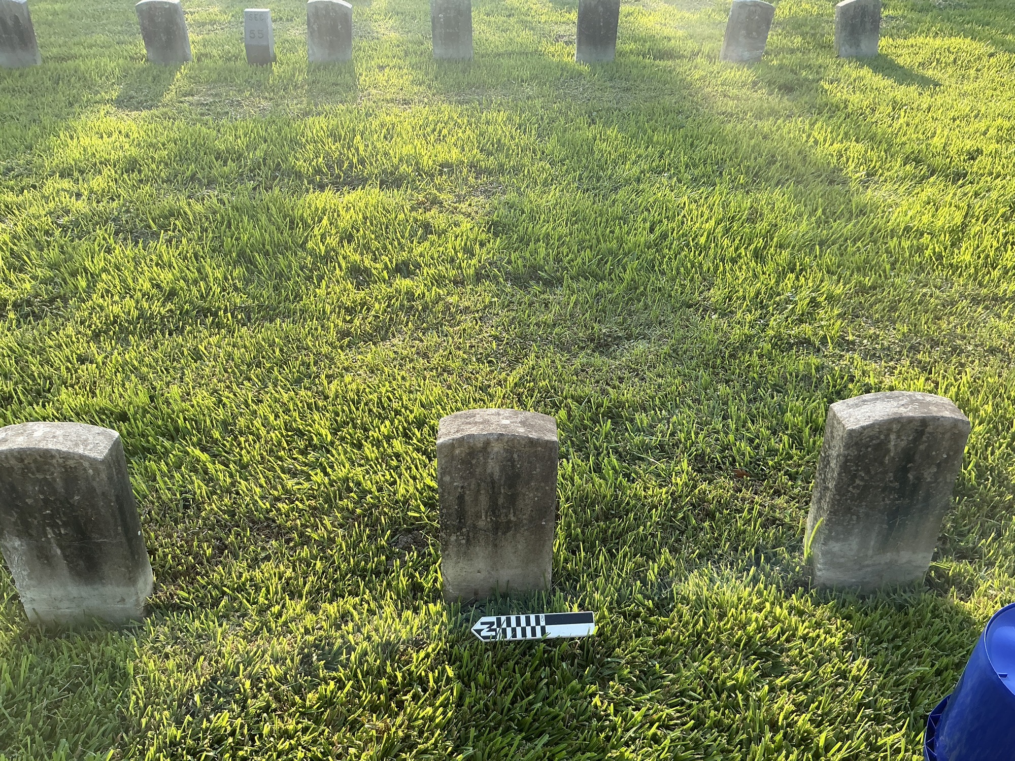 Extra image of historic upright marble headstone with recessed shield face.