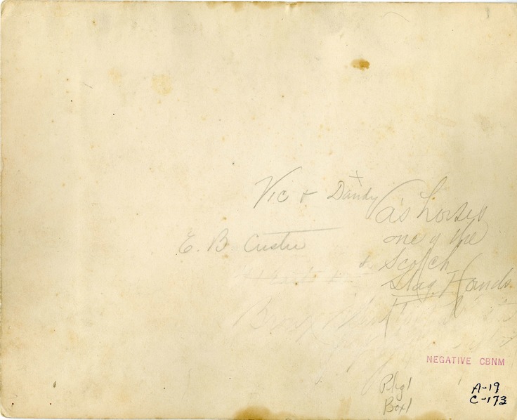 John Burkman with Dandy and Vic [George Armstrong Custer's Horses] and Four Hounds