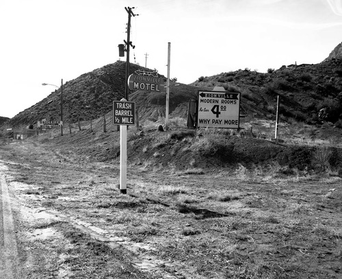 Roadside signs in Springdale on State Route 15 (now State Route 9) an array of signs near Zionville market approximately 200 yards south west of the park entrance. For documentation for the proposed cleanup project for the removal of undesirable signs and debris on the main access route to Zion National Park.