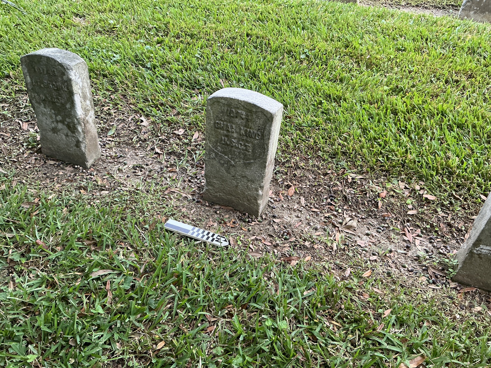 Extra image of historic upright marble headstone with recessed shield with recessed lettering face.
