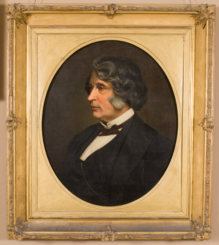 Bust-length portrait painting of man in suit with graying hair and sideburns in 3/4 profile, in gold frame