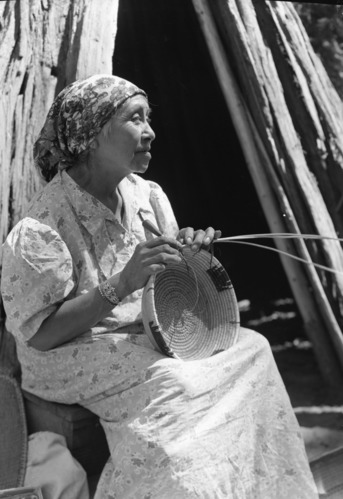 Lucy Telles, profile view, weaving basket