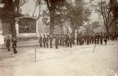 54th Regiment marching in rows by the Shaw 54th Regiment Memorial. 