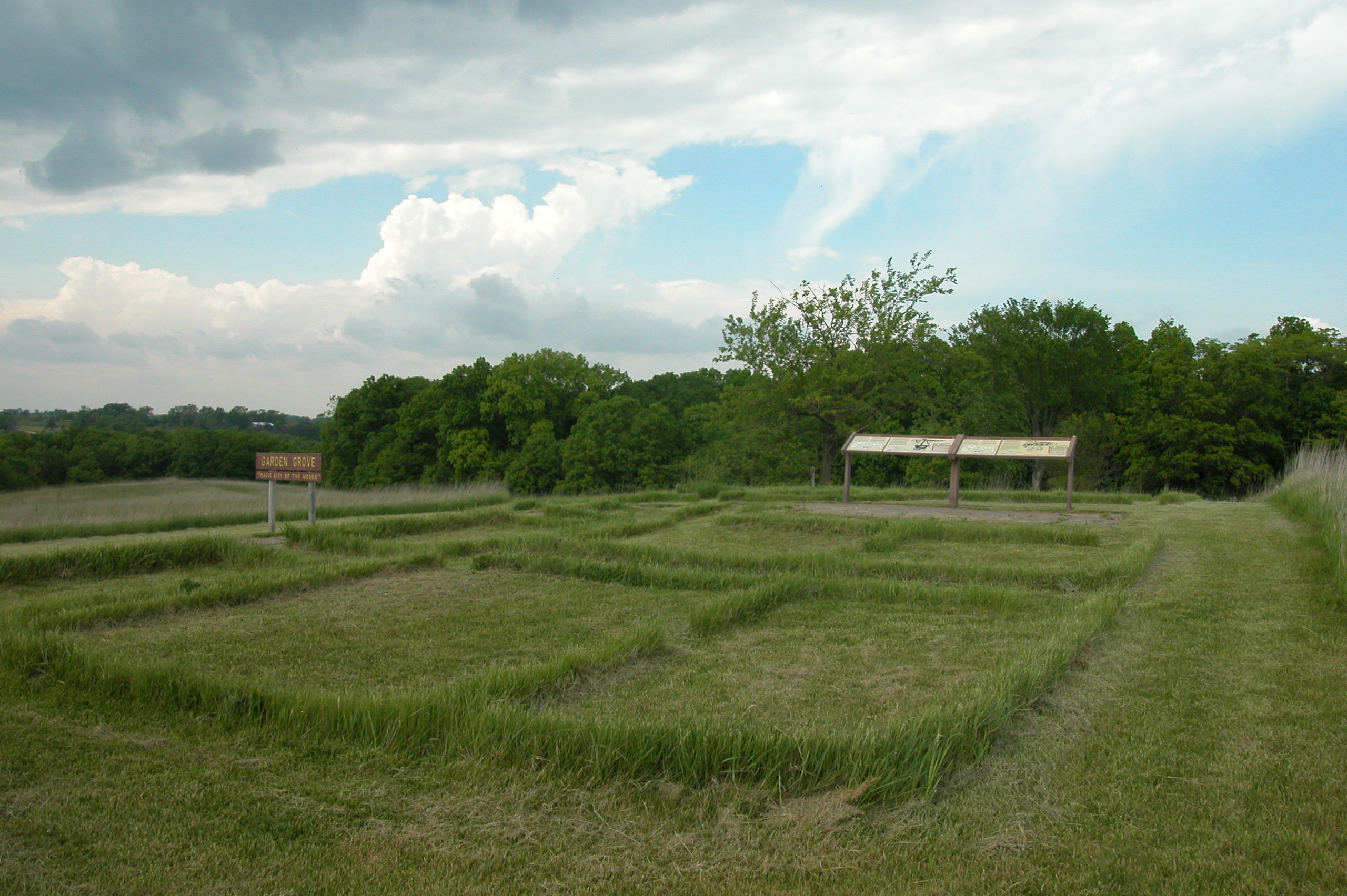 Image of building foundations on a grass field.