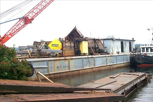 Dock construction using barge at Tookers Island, Isle Royale, 1999