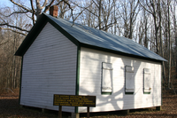 Buttin Rock Schoolhouse is located near Blue Spring on the Current River.