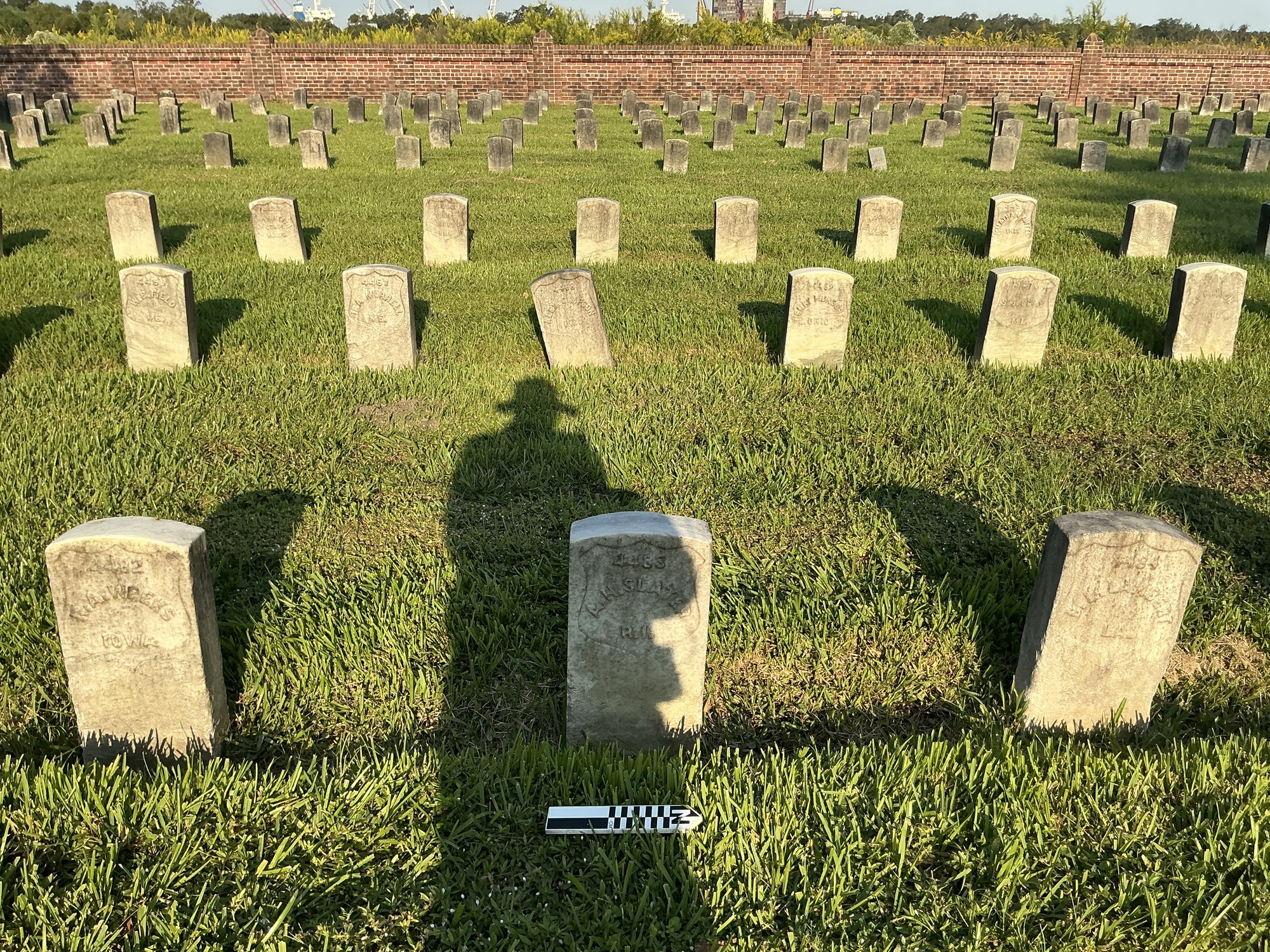Extra image of historic upright marble headstone with recessed shield face.