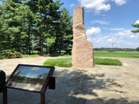 A granite monolith stands as a focal point to this 