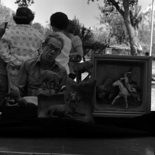 Leo Fesler with his wildlife carvings at the second annual Folklife Festival, Zion National Park Nature Center, September 7-8, 1978.