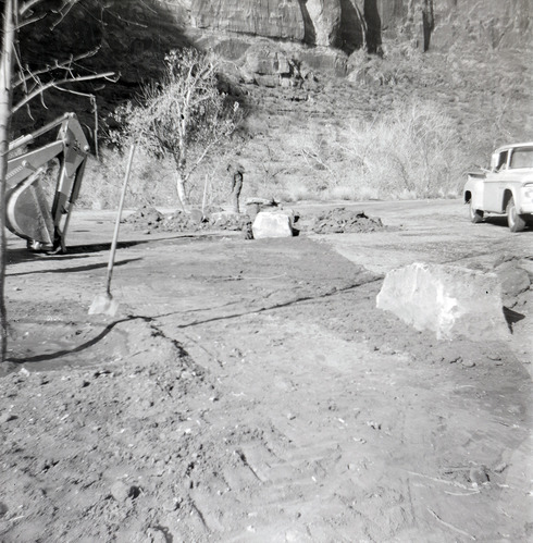 Man working on maintenance of the Great White Throne parking area during construction.