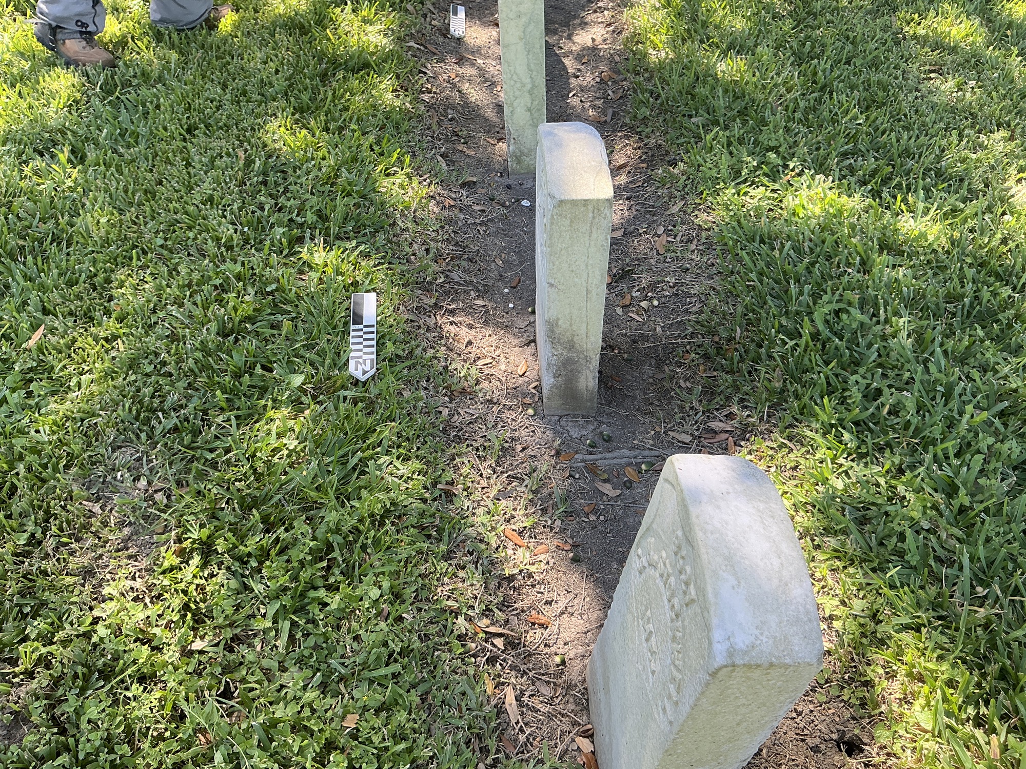 Extra image of historic upright marble headstone with recessed shield with recessed lettering face.