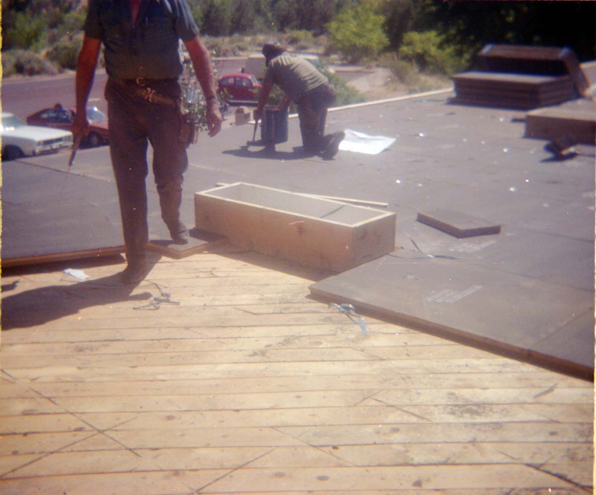 Workers laying roofing slabs during the headquarters/visitor center roofing project.