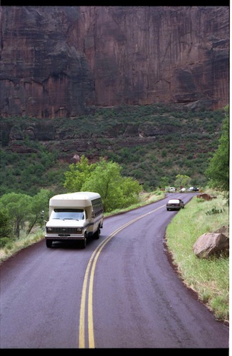 Color photo of SAR team transporting injured man.