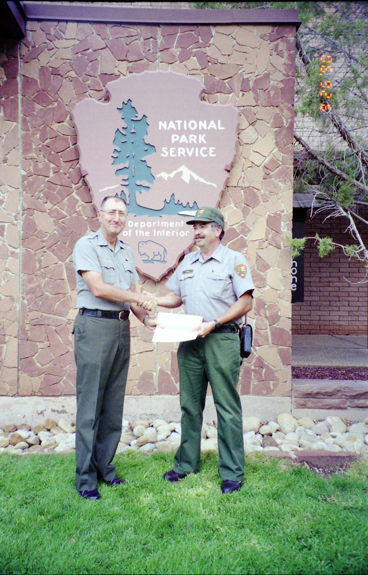 Color Photos of Superintendent Harold Grafe giving out awards to park personnel.