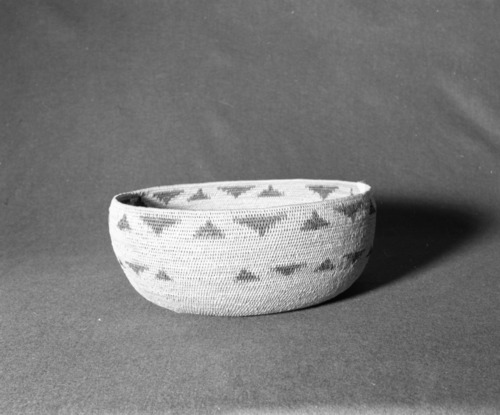 Marie Rozier Collection, Catalog No. 49. Object: Miwok Basket. Dimensions: 13 x 5 1/2". Materials: bullpine, fern root. Technology: single rod; oval start; fag ends trimmed on work face; moving ends clipped on interior; leftward coil direction. Collection History: From the Alice Reade collection. Photographed by Michael Dixon, December 1982. Catalogued by Craig Bates and Barbara Beroza. Yosemite Collections, National Park Service.