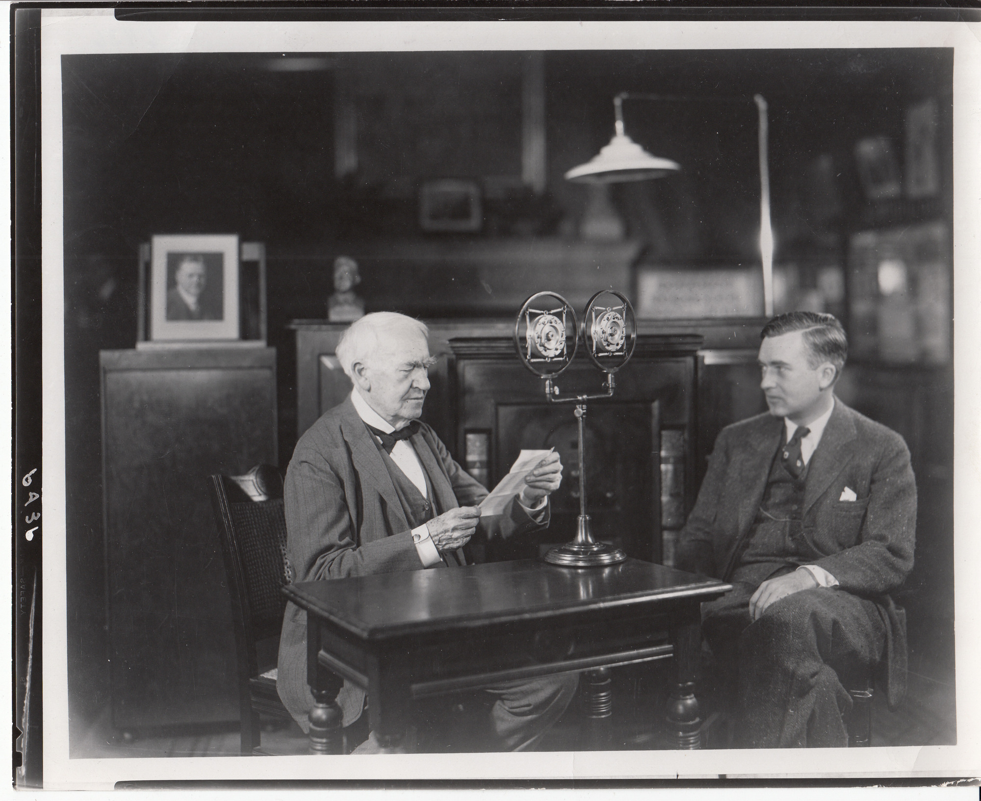 Charles Edison with Thomas Edison in the Building 5 Library. Thomas Edison is broadcasting to Schenectady, New York, on the occasion of a plaque dedication at the first General Electric building there.