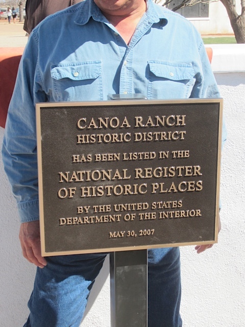 A bronze plaque says Canoa Ranch Historic District has been listed in the National Register of Historic Places by the United States Department of the Interior May 30, 2007