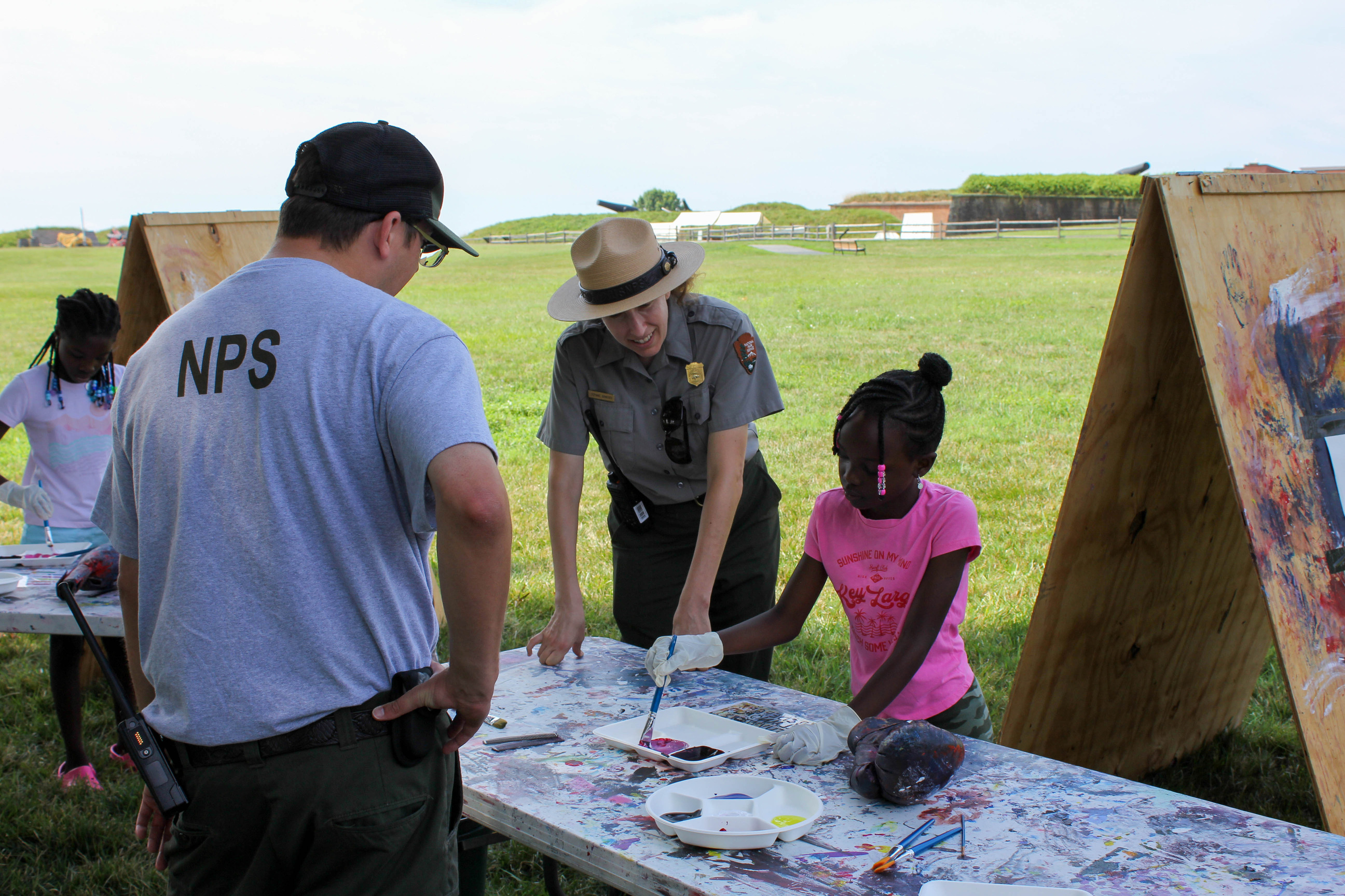 Rangers helping children paint