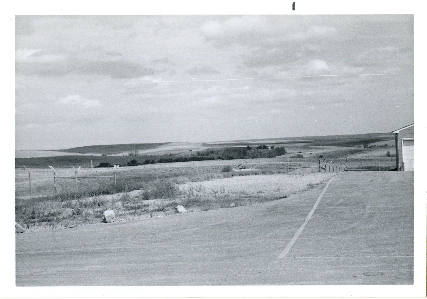 Prairie lanndscape from a fenced compound