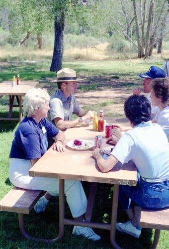 Color Photos of the parks 72nd anniversary celebrations- cake cutting, barbecue, speakers.