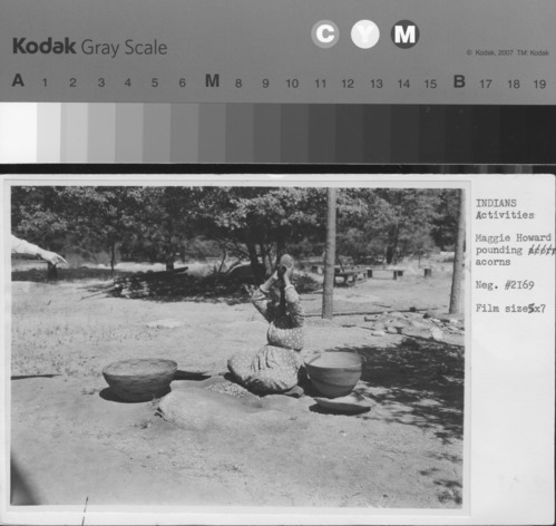 Maggie Howard pounding acorns