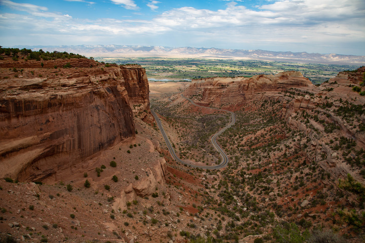 Road curving through a red-rocked canyon