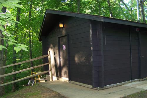 Paint and stain exterior of historic structures in camp 3 and camp 5 at Prince William Forest Park in June 2012.