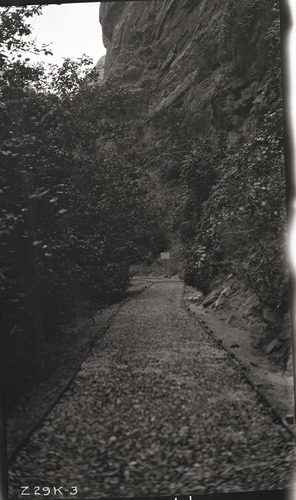 Narrows Trail construction with a view of the pavement base sprayed with bitumuls and rolled.