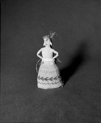 Marie Rozier Collection, Catalog No. 2-88. Object: Quinault doll. Dimensions: 9 1/2". Materials: Raffia weft, Scirpus sp. weft. Collection History: Made by aged Quinault lady. Acquired 1964 by Mary Long. Photographed by Michael Dixon, December 1982. Catalogued by Craig Bates and Barbara Beroza. Yosemite Collections, National Park Service.