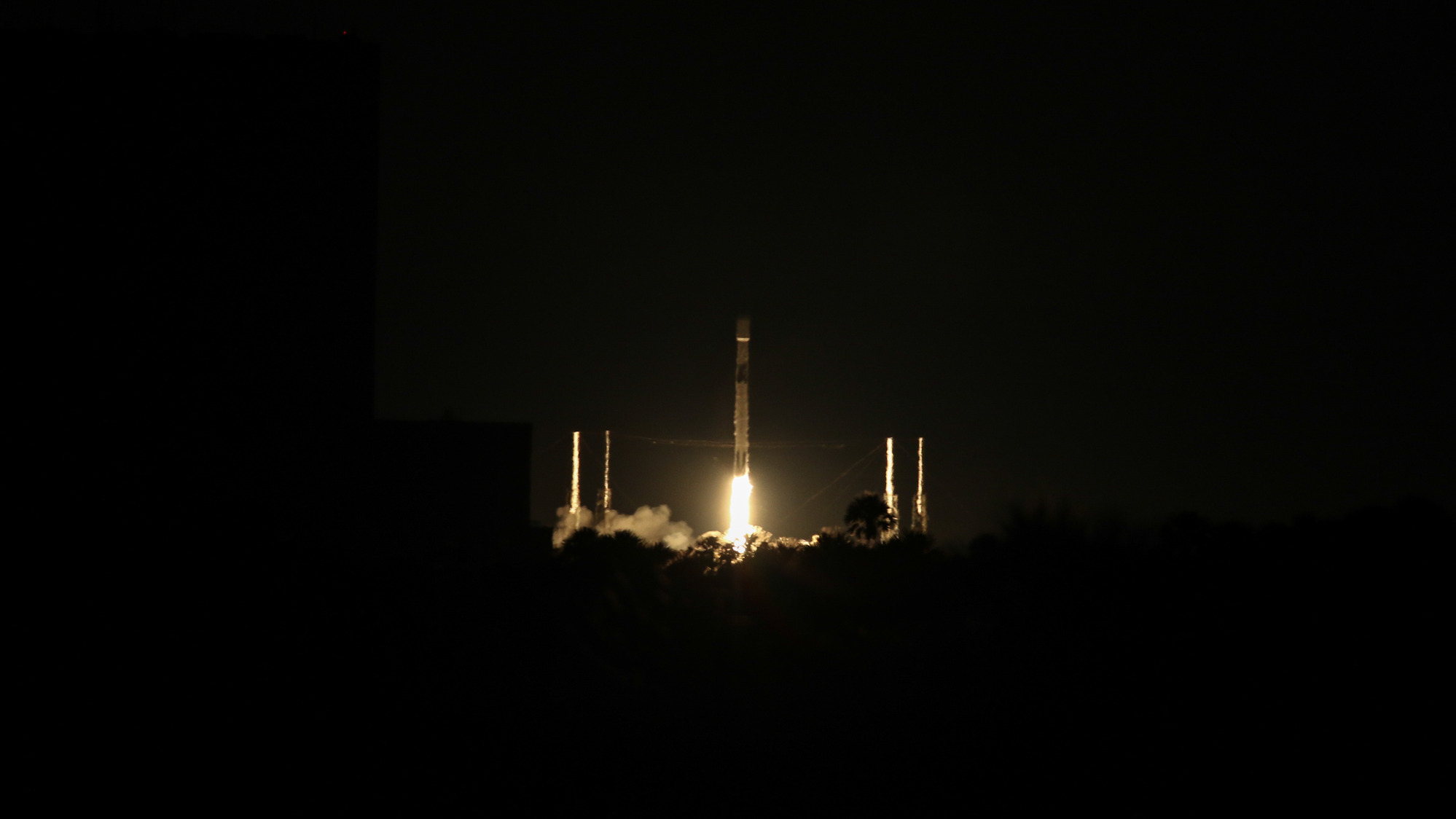A rocket launching at night.