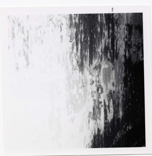 The interior of the 40000 gallon water tank showing buildup/corrosion.