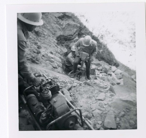 Workers repairing trail damage on the Hidden Canyon trail.