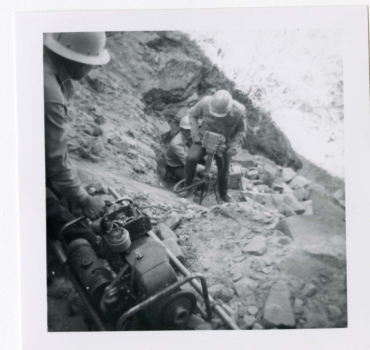 Workers repairing trail damage on the Hidden Canyon trail.