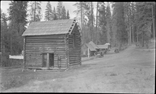 T. J. Hodgdon: Looking north up the Tioga Road towards Tuolumne Meadows. The log cabin in the foreground is Mr. Hodgdon's homestead cabin* (now relocated at the Wawona Pioneer History Center). The soldiers used it as a store house at the time of their guardianship. *Not according to Margaret Schlichtman.