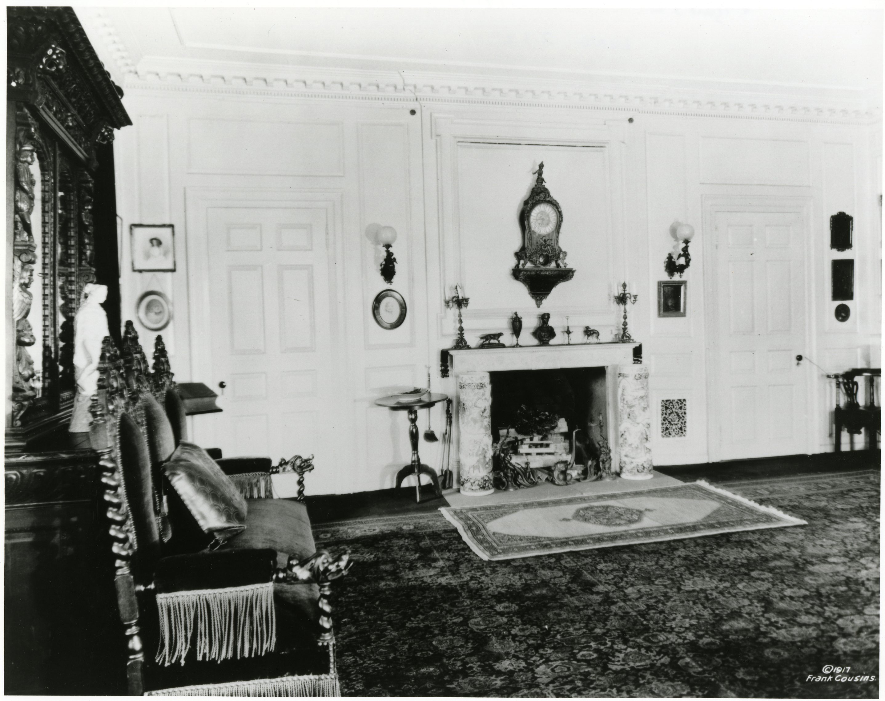 Black and white photograph of large 19th century library.