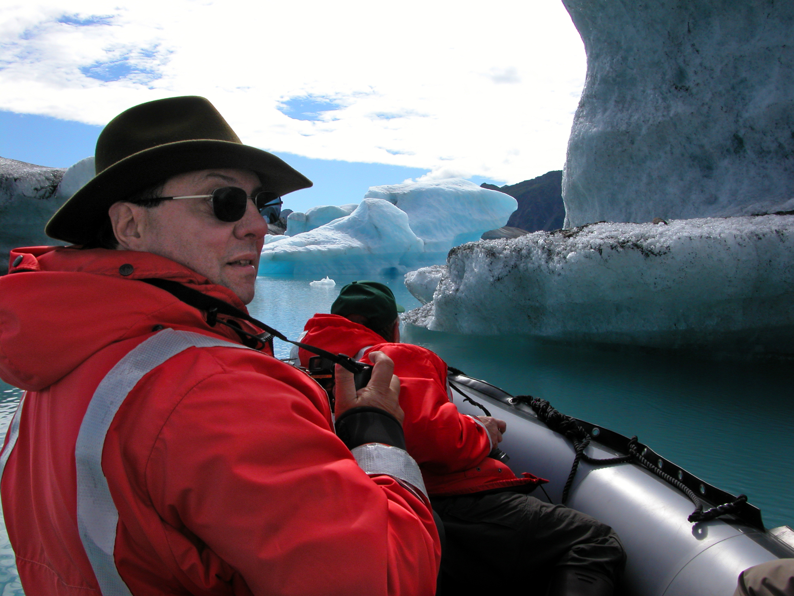 Researcher looks at iceberg in Bear Glacier Lagoon 2005