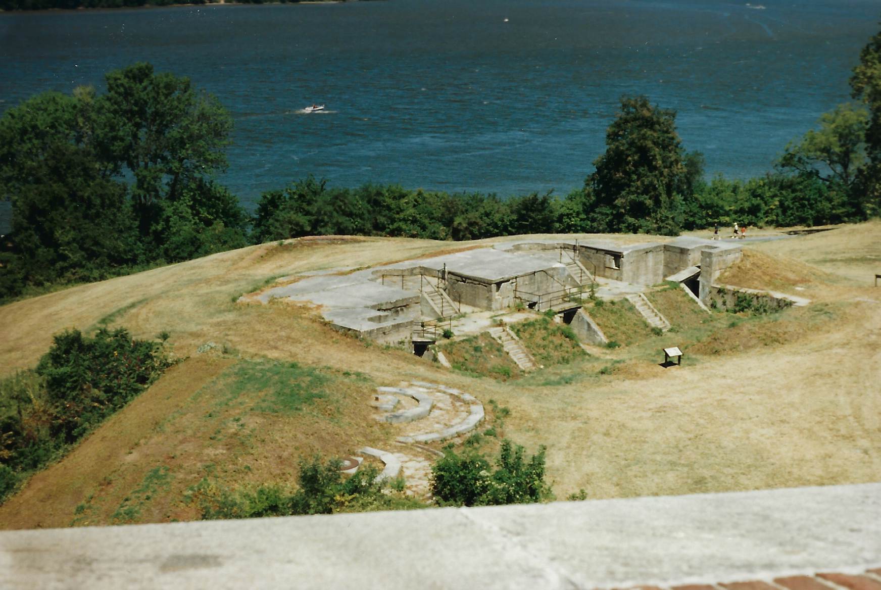 Photo of concrete gun battery, taken above in the fort.  To the left of the photo are two large cannon stone cannon mounts for 15-inch Rodman Cannons.  